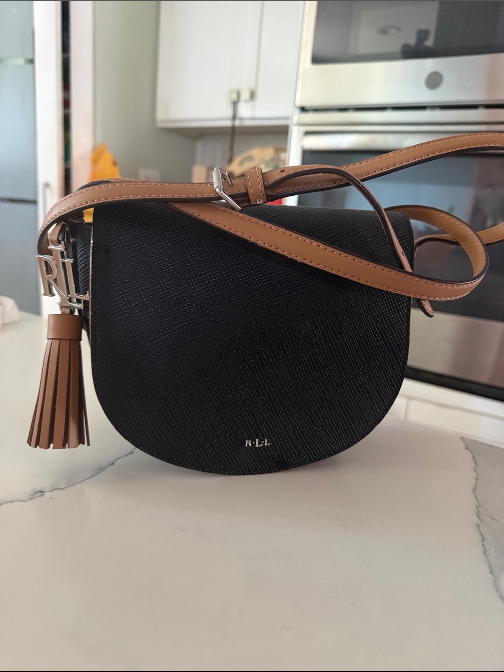 Ralph Lauren Black and Tan Saddle Crossbody with Tassel Charm